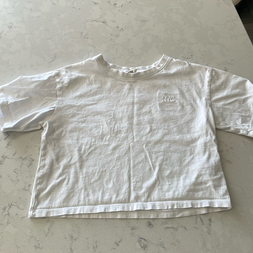 H&M girls white crop tshirt. Size 10-12y. NYC stitching on left side.